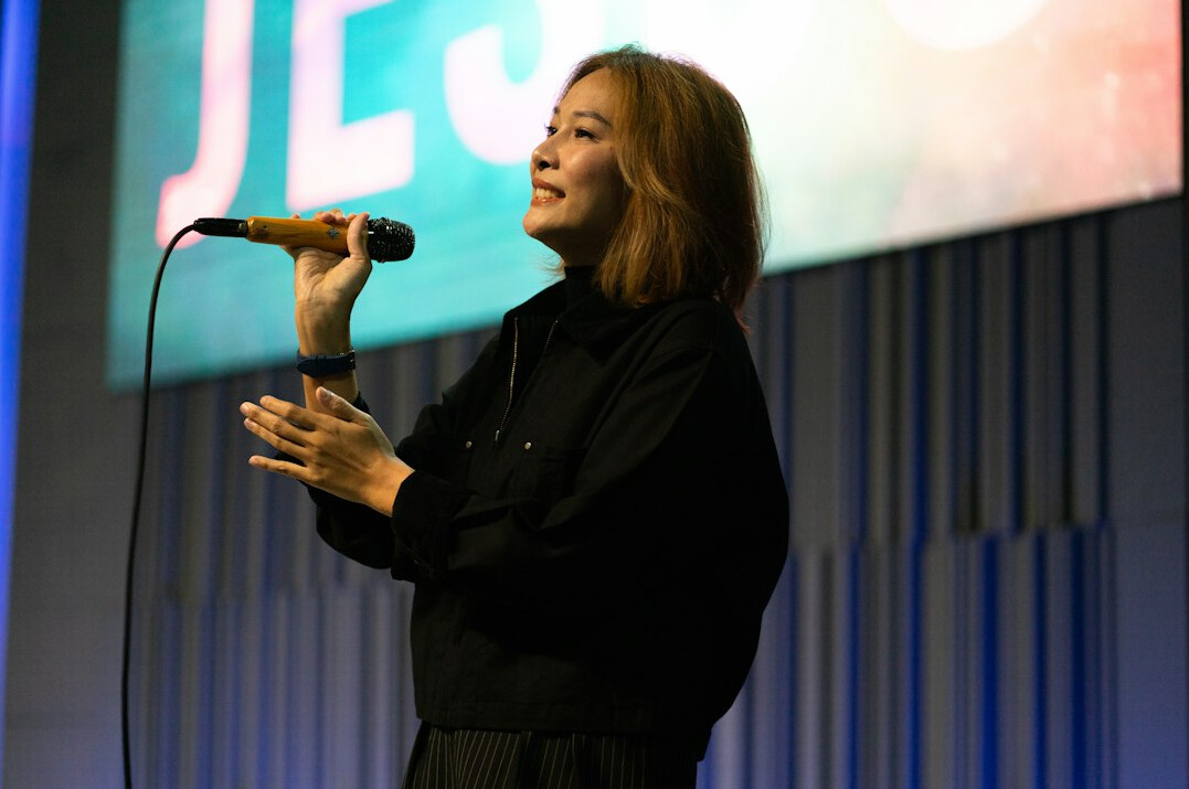 person giving speech on stage