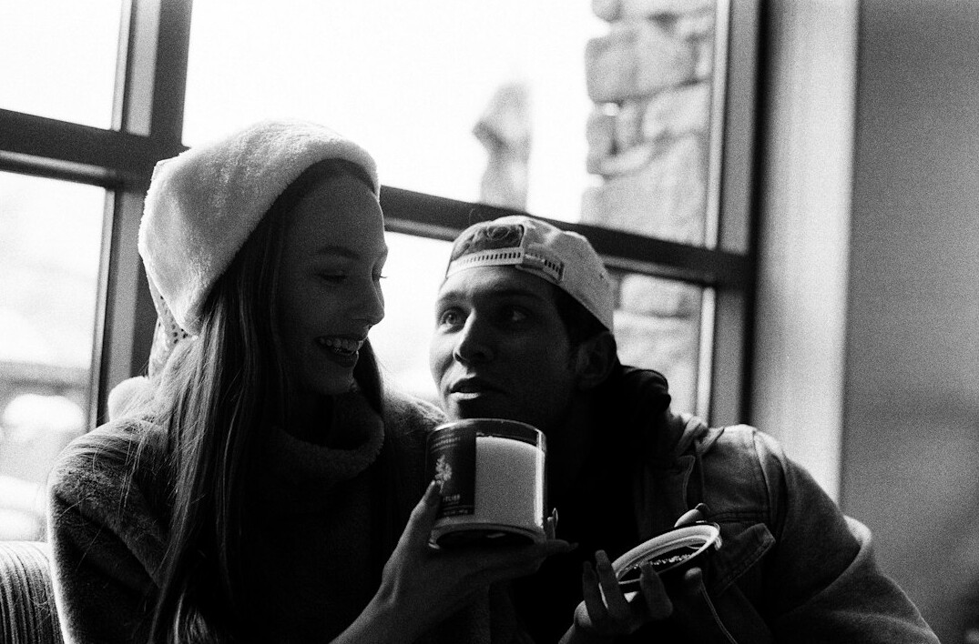 Two people chatting with coffee