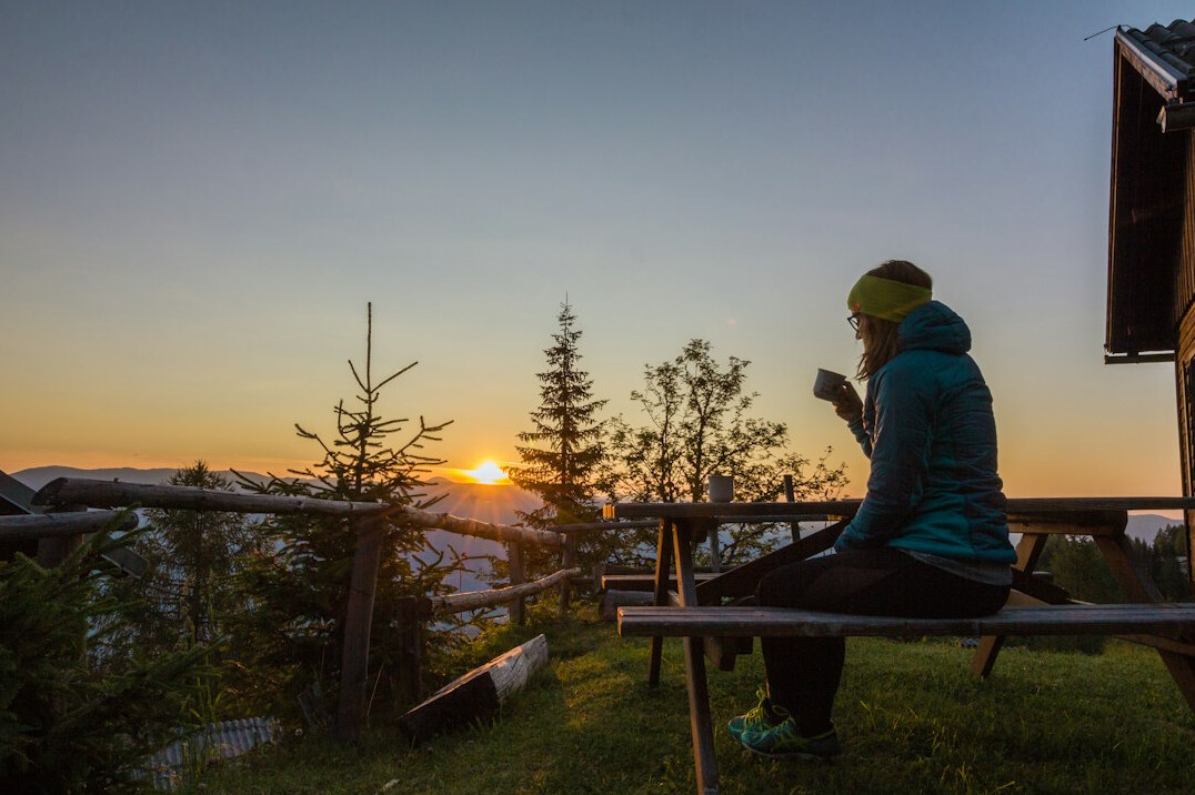 person journaling at sunrise