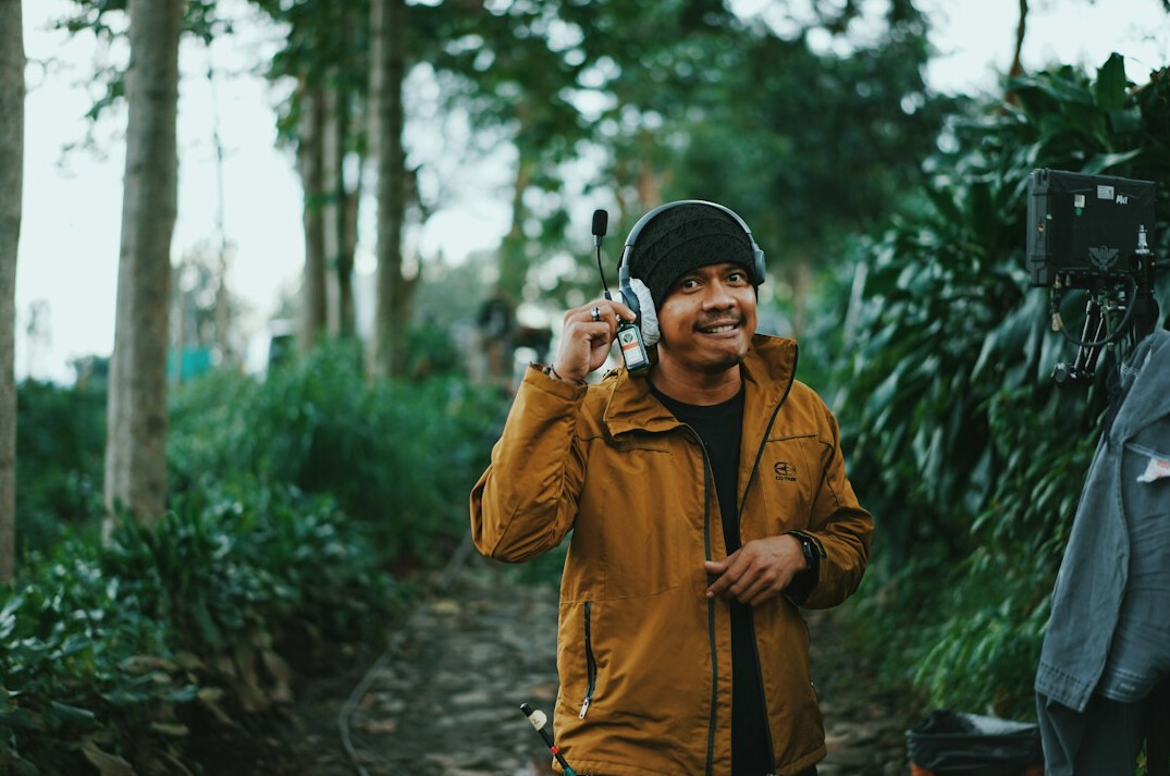 man listening to podcast while walking