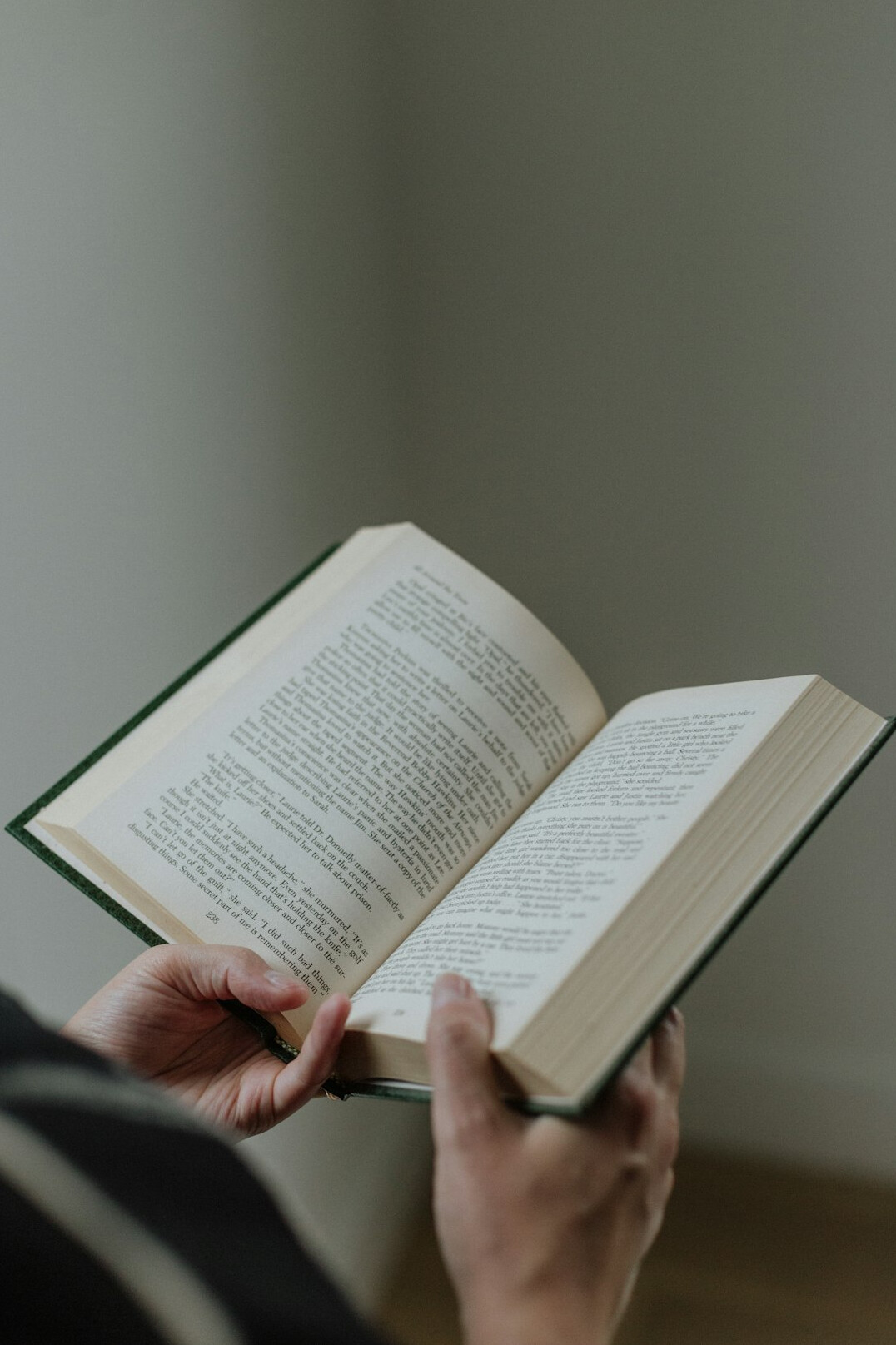 person reading self help book
