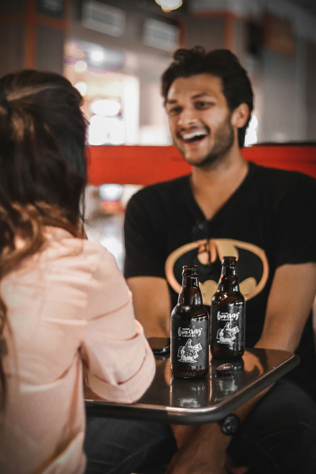 Two people having a friendly conversation at a table